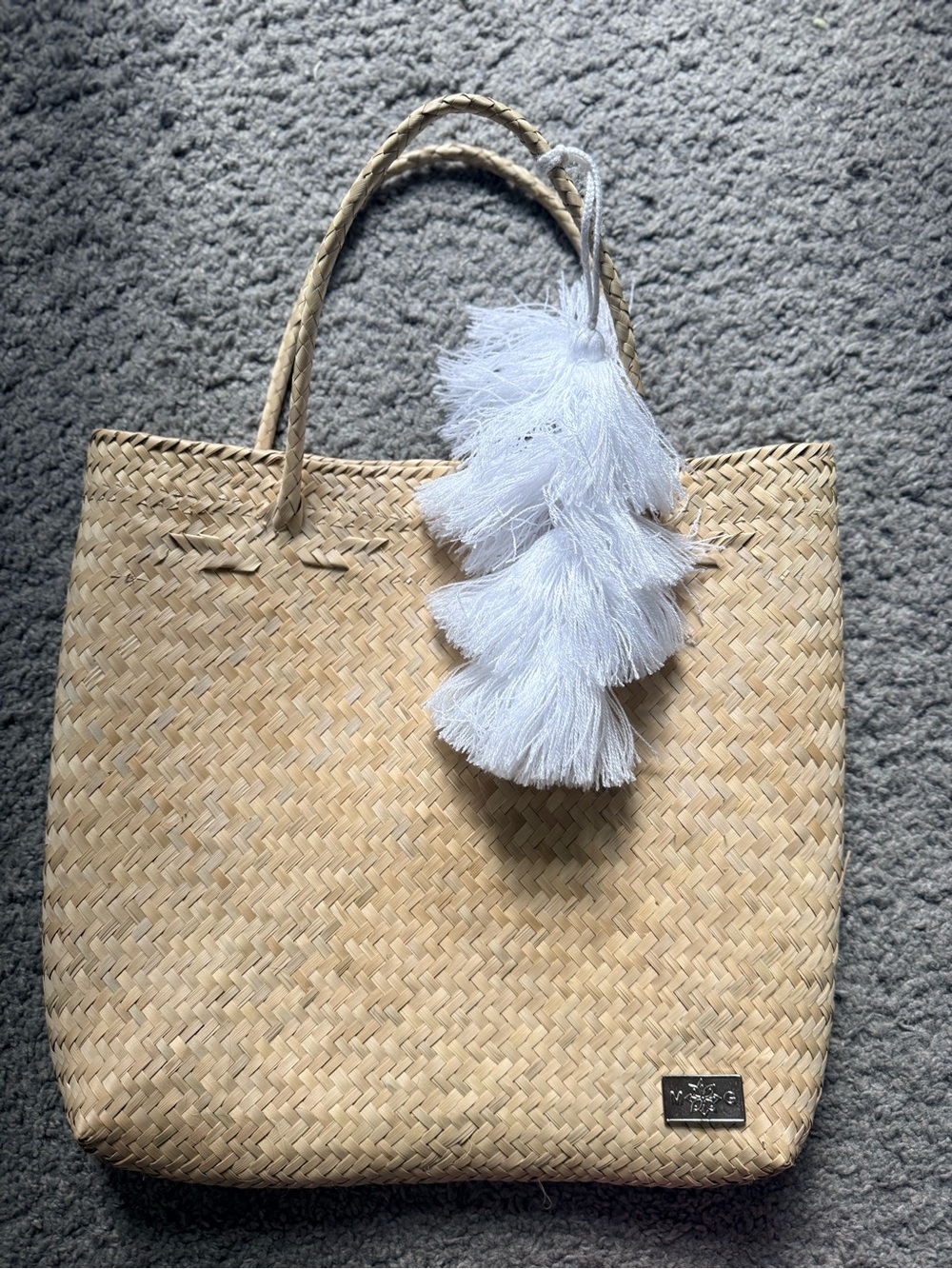 Natural Woven Tote Bag with White Tassel Accent